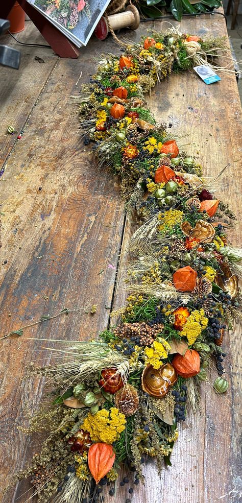 Vibrant colors of Fall, this Harvest garland is a great table decoration, Mantle accent or door decoration instead of a wreath. They are long lasting happy colorful garland s. Please let m,e know if you need a special length or anything added or replaced. Feathers, nuts, pinecones, mushrooms.... and more Fireplace Decor Mantle, Harvest Garland, Dried Flower Garland, Brown Fireplace, Mantel Flowers, Garland Fireplace, Fall Garlands, Handmade Garland, Colorful Garland