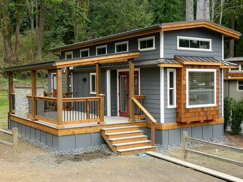 Great looking little cottage with deck. Love the high roof and windows. It's pretty close to what I'm thinking for my owner-build :D Roof Porch, Cabin Deck, Deck Skirting, Tiny House Towns, Park Model Homes, Small Cottages, A Small House, Steel Roofing, House Cabin