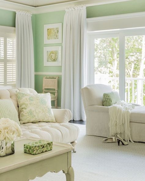 Stunning ivory and mint green bedroom features mint green walls adorned with white chair rail trim alongside window and sliding patio doors dressed in white floor length drapes. Light Green Bedrooms, Mint Green Bedroom, Mint Green Rooms, Green Bedroom Walls, Mint Green Walls, Cottage Shabby Chic, House Of Turquoise, Green Walls, Cottage Bedroom