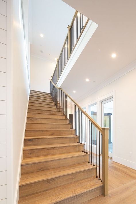 White Oak Staircase The staircase features White Oak threads, custom stained to match the hardwood flooring, metal spindles and White Oak railing and baluster #whiteoak #staircase #whiteoakstaircase #whiteOakthreads #staircasethreads #hardwoodflooring #metalspindles#WhiteOakrailing #railing #baluster White Oak Staircase, Yellow Bedroom Paint, Mediterranean Style Interior, Oak Staircase, Stair Design, White Oak Hardwood Floors, Oak Stairs, Wood Staircase, Farmhouse Inspiration