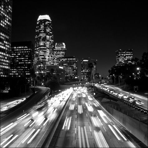 Black and white picture of the Los Angeles Skyline at night along the Harbor Freeway. Black And White Iphone Wallpapers, Black White Wallpaper Iphone, Los Angeles Dark Aesthetic, Los Angeles Wallpaper Night, White Wallpaper Iphone, La City Lights Night Los Angeles, Los Angeles Black And White, Black And White Los Angeles, Los Angeles Night City Lights