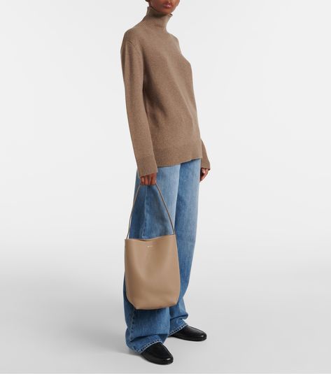 N/S Park Medium leather tote bag in beige - The Row | Mytheresa The Row Tote Bag, The Row Bag, Bag Collection, Cashmere Turtleneck, Leather Tote Bag, Leather Loafers, Wide Leg Jeans, Turtleneck Sweater, Leather Tote