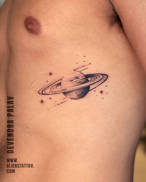 Creative Small Tattoos For Men, Planet Tattoos Small, Small Space Tattoo Ideas For Men, Minimalistic Tattoo Ideas For Men, Unique Saturn Tattoo, Mini Saturn Tattoo, Tattoo Ideas Minimalist Men, Tattoo Chest Men Small, Planet Hand Tattoo