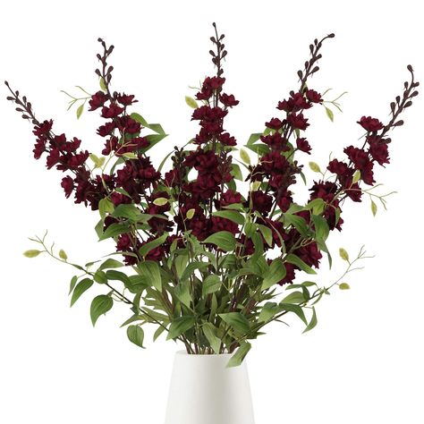 PRICES MAY VARY. Size and Package: IPOPU fake flowers box set include: dark red delphinium artificial flowers 5pcs + 4pcs clematis leaves with stems, the artificial delphinium burgundy flowers is total approx. 33.5”/ 85cm height, the larkspur flower part height size 19.3"/49cm, the clematis greenery is 23.6"/60cm length, the dark red long stem flowers combo is great for your long stem artificial flowers for tall vase floral arrangements Premium Silk Flower Material: The burgundy artificial flowe Burgundy Fall Centerpieces, Red Delphinium, Flowers For Wedding Centerpieces, Silk Flowers For Wedding, Dark Red Flowers, Larkspur Flower, Stem Flowers, Home Table Decor, Long Stem Flowers