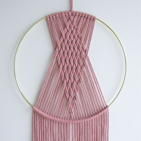 Gorgeous blush pink macrame wall hanging, featuring a woven diamond design on a 25cm gold coloured hoop. This high quality, handmade piece is also available in terracotta or white. DIMENSIONS: - Metal hoop: diameter - 25cm (10 inches) - Length (including cotton hanger): approx. 71cm (28 inches) MATERIAL: Blush pink / Terracotta - 3mm 100% recycled cotton cord White - 80% cotton, 20% other fibres, 3mm cord DELIVERY INFORMATION  Orders are dispatched within 1-3 working days via EVRI. Free standard Macrame On A Hoop, Pink Macrame Wall Hanging, Diy Wall Hanging Yarn, Pink Terracotta, Pink Macrame, Handmade Dream Catcher, Macrame Hoop, Macrame Dream Catcher, Macrame Knots Tutorial