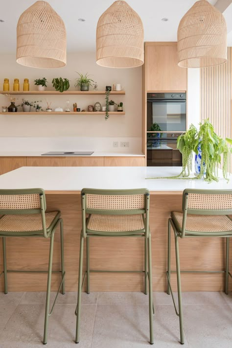 Scandinavian kitchen in London with central island, rattan lamspades, corian worktop and green bar stools Scandinavian Kitchens, Scandi Kitchen, Scandinavian Kitchen Design, London Kitchen, Sustainable Kitchen, Stools For Kitchen Island, Scandinavian Kitchen, Kitchen Trends, Stylish Kitchen