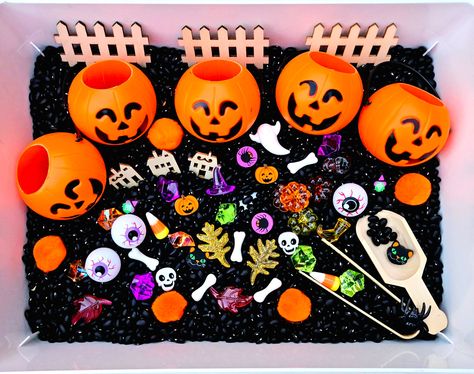 This listing DOES NOT include the plastic container that is pictured. Any bin would work for this kit, but I recommend something around 10"x13"x3" size range. Your littles will have so much fun with this Five Little Pumpkins Sensory Bin! This Halloween Sensory Bin includes everything little minds need to spark imagination and creativity! This bin invites children to learn while playing. They will: o Develop hand-eye coordination and fine motor skills, such as pouring and grasping o Explore textures, counting and stacking o Practice memory and rhyme o Have fun being creative! This Five Little Pumpkins sensory bin includes: 2lb bag of black beans, 5 mini plastic pumpkins, 1 wooden scoop, 1 tongs, wooden fence, acrylic gems, orange pom-poms, and more for a fun Halloween theme activity!  This Halloween Sensory Bin Ideas, Sensory Bins Halloween, Halloween Sensory Bin Preschool, Sensory Table Halloween, Halloween Sensory Bin Toddlers, Halloween Sensory Table, Sensory Box Ideas, Jack O Lantern Sensory Bin, Sensory Halloween Boxes