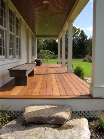 Front Porch High Off Ground, Front Porch Material Ideas, Country Style Front Porch, Front Porch Peak, Stained Wood Front Porch Floor, Peaked Front Porch, Treated Lumber Front Porch, Wood Front Porch, Wood Under Front Porch Ceiling