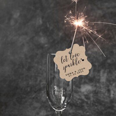 Wedding sparkler tags are a wonderful way to add sparkle and love to the end of your wedding reception. Personalize these "let love sparkle" tags with the couple's name and wedding date. Make it memorable with these matte-finished cardstock tags, 96 tags per pack. It is perfect for purchasing in bulk and can be used for different types of events such as bridal showers and engagement parties. Plan for a special sparkling send-off with personalized tags on each sparkler. The fireworks and sparkler Let Love Sparkle Wedding, Wedding Fireworks Sparklers, Wedding Sparklers Display, Wedding Sparklers First Dance, Sparklers Wedding Sign, Sparkler Tags, Wedding Sparkler Tags, Let Love Sparkle, Fancy Frame