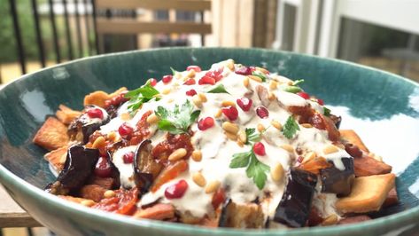 This Levantine Aubergine Fatteh is the perfect midweek meal with tons of great texture and flavour. Only taking about 30 minutes to cook, it's made of Layered Crispy Pitta and Eggplant topped with a tangy tomato sauce and tahini yoghurt sauce. Eat it hot or warm and I guarantee you'll finish the whole thing in one sitting. The post Levantine Aubergine Fatteh appeared first on Book Recipes. Aubergine Fatteh, Eggplant Fatteh, Stuffed Aubergine, Yoghurt Sauce, Tahini Paste, Pitta Bread, Lebanese Food, Pomegranate Molasses, Midweek Meals