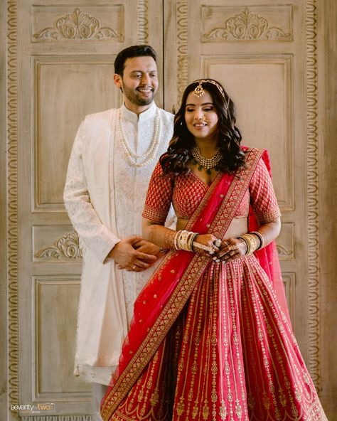 Dhwiti stuns in a breathtaking red lehenga, perfectly complemented by Kanai’s regal white sherwani.

#sbtrides #seventybytwo #weddingphotographer #weddinginspiration #lehengalove #pastelweddings Ivory Sherwani Grooms, Red Sherwani, White Sherwani, Sherwani Groom, Wedding Stories, Red Lehenga, Pastel Wedding, Wedding Story, Bridal Inspiration