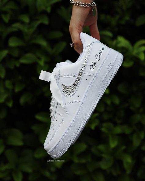 Stepping into forever with a touch of sparkle. ✨ Our custom Air Force 1 low bridal sneakers are the perfect blend of style and comfort for your special day. 👟💐. . . . . . . #BridalSneakers #CustomKicks #bridetobe #bride #weddingideas #weddingstyle #bridalshoes #bridestyle #bridesmaids #bridesmaid #nike #rhinestones #satin #airforce1 #customsneakers #sneakernews Sneakers For Bride, Wedding Sneakers For Bride, Shoes Air Force, Air Force 1 White, Bride Personalized, Bridal Sneakers, Wedding Sneakers, Shoes Air, Custom Bridal