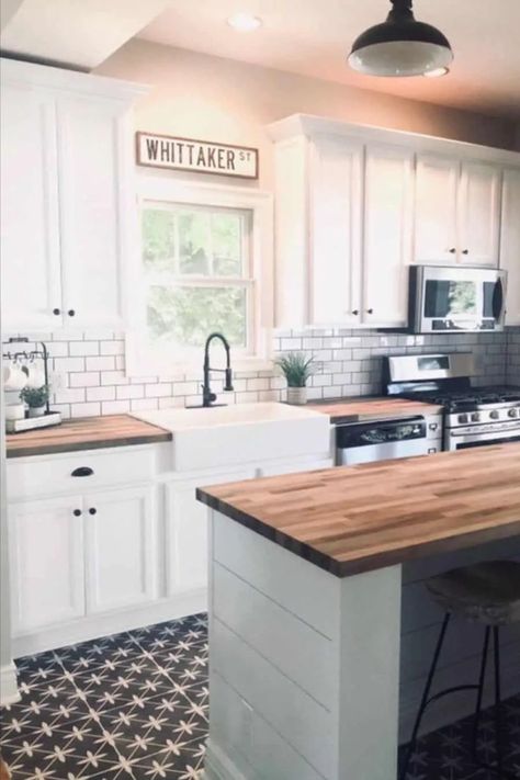 Experience the sophisticated charm of this farmhouse kitchen, boasting a white shiplap island against pristine white cabinets. The timeless design is accentuated by butcher block countertops and a classic white subway tile backsplash. Infuse character into the space with a captivating black and white mosaic tile floor. Black And White Mosaic Tile Floor, Shiplap Island, Cottage Farmhouse Kitchen, Kitchen Ideas For Small Spaces, Patterned Tile, Farmhouse Kitchen Ideas, Cottage Farmhouse, Butcher Block Countertops, Butcher Block