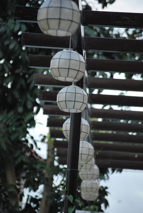 Capiz lights hanging from our garden trellis. Capiz Light, Lights Hanging, I Want To Live, Garden Trellis, Deck Ideas, Hanging Lights, Outdoor Lighting, Home Sweet Home, Sweet Home