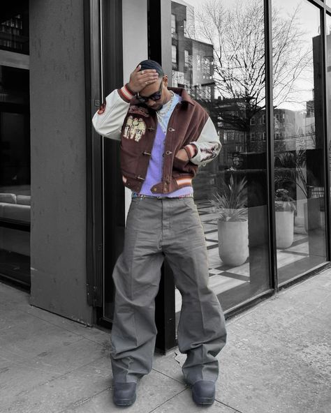 How about his color? 🍩 Outfit info 👇🏻 • • • 📸 @sylves1er 🇺🇸 🕶️Eyewear : basketcase 🧥Outer : be you 👔Top : jooniverse lab 👖Bottom : rick owens online 👞Shoes : bottega veneta • • • • • • brown varsity jacket, purple vest, gray baggy pants, boots, sunglasses, men’s outfit, usa Gray Baggy Pants, Purple Shoes Outfit, Brown Varsity Jacket, Brown Jacket Men, Purple Vest, Outfit Info, Purple Vests, Pants Boots, Outfits Streetwear