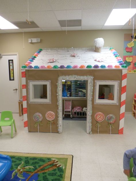 We turned our play house  into a gingerbread house Cardboard Gingerbread House Lifesize, Gingerbread Playhouse, Polar Express Christmas Party, Cardboard Gingerbread House, Gingerbread Activities, Ginger House, Food Fair, Cardboard House, Candyland Decorations