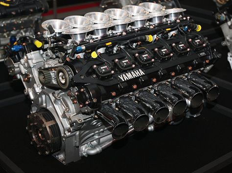 In 1989, Yamaha Motor began its challenge in Formula 1, the pinnacle of automobile racing, as an engine supplier. Exclusively developed V8, V10 and V12 engines were supplied to the renowned Brabham, Jordan, Tyrrell and Arrows F1 teams. The OX99 5-valve V12 F1 engine pictured here was supplied to the Brabham and Jordan teams. In 1992, Yamaha developed the "OX99-11" production supercar that mounted this GP engine. In all, Yamaha's F1 challenge lasted for nine years. During that time, Yamaha engin Yamaha Engines, Automobile Engineering, V12 Engine, Yamaha Motor, Motor Engine, Performance Engines, Race Engines, Combustion Engine, Car Engine