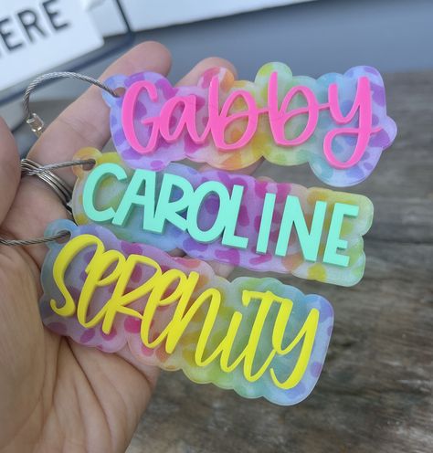 Please read the entire listing before ordering These personalized layered keychains are made with two layers of high quality 1/8"  acrylic. Each keychain comes with a wire keychain cable. See photos for the different acrylic color and font options. PERSONALIZATION OPTIONS: Acrylic color: hot pink, bright orange, bright yellow, lime, turquoise, aqua, pacific blue, purple, or lilac MORE DETAILS: They will be around 3.5" in length depending on the text. Names with less letters may be a little shorter and a little taller. HOW TO ORDER: 1. Select the first drop down menu to choose your color and add to cart.   2. Select the drop down menu to choose your font and add to cart.   3.  In the personalization box, type the name/word you want for the keychain exactly as you want it. You will need to d Easter Tag, Custom Bag Tags, Personalized Bag Tags, Bogg Bag, Easter Tags, Backpack Tags, Keychain Personalized, One Drop, Pacific Blue