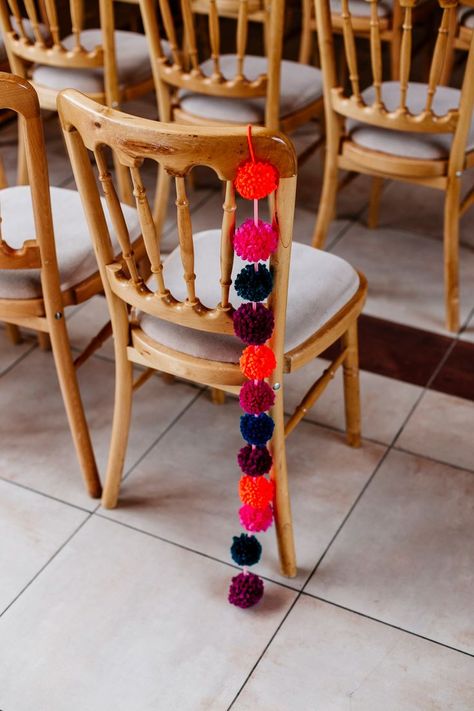 Pom Pom Chair Back Decor | Colourful Alternative Winter Wedding at Upwaltham Barns, Sussex | Epic Love Story Photography Pom Pom Wedding Decor, Love Story Photography, Joanne Fleming, Sangeet Decor, Bridesmaid Separates, Pom Pom Decor, 21st Bday Ideas, Epic Love, Story Photography