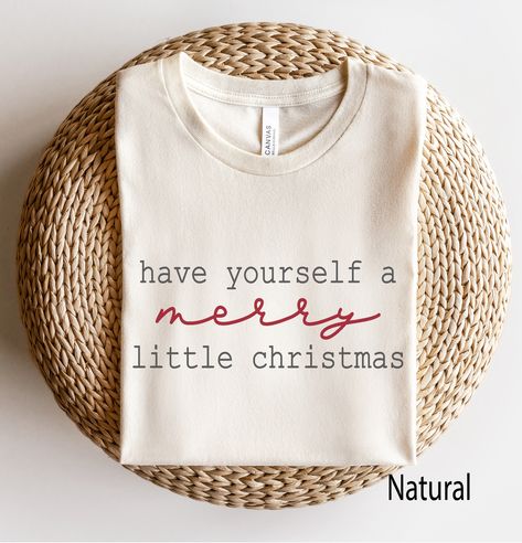 Have Yourself a Merry Little Christmas Minimal Graphic T Shirt - perfect under your favorite jacket, blazer or cardigan  - just add boots!  Looking for more Christmas and Winter themed apparel? Check these out: https://www.etsy.com/shop/TheGraphicPeach?ref=seller-platform-mcnav§ion_id=30496778 Our shop uses direct-to-garment printing to make our products. The design ink is sprayed on, then allowed to soak into the fibers of the garment. This process yields fine quality prints and a smooth finish on the garment. BELLA + CANVAS T SHIRT The Bella + Canvas 3001 t-shirt feels soft and light, with just the right amount of stretch. It's comfortable and the unisex cut is flattering for both men and women. We can't compliment this shirt enough - it's one of our crowd favorites. And it's sure to be Christmas Printed Shirts, Funny Womens Christmas Shirt, Cricut Christmas Pjs, Diy Christmas T Shirts Ideas, Cricut T Shirt Ideas Women, Christmas Design Tshirt, Holiday Tshirts Ideas, Christmas T Shirt Design Ideas, Winter Graphic Tees