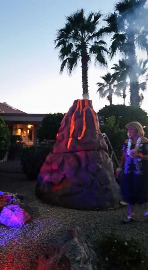 I created this for a Hawaiian Luau. That's me in the muumuu. Jungle Halloween, Fake Rock Covers, Jungle Project, Spooky Island, Jurassic Park Party, Park Party, Diy Prom, Fake Rock, Vbs 2023