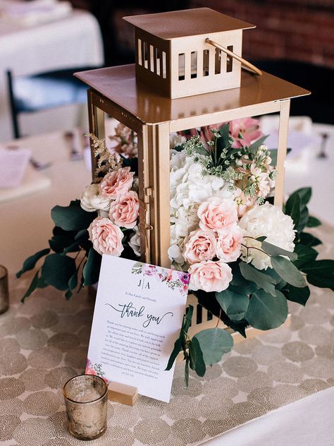 Fill gold lanterns with flowers, like this one brimming with roses for a wedding centerpiece that will light up the night. Rustic Lantern Centerpieces, Lanterns With Flowers, Lantern Centerpiece Wedding, Simple Wedding Centerpieces, Gold Lanterns, Lantern Centerpieces, Bridal Shower Centerpieces, Unique Wedding Flowers, Wedding Floral Centerpieces