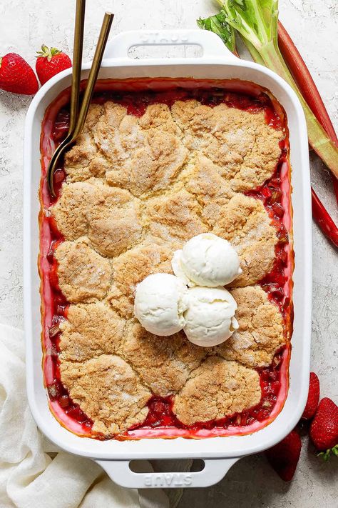 This easy, sweet-tart Strawberry Rhubarb Cobbler recipe features a jammy filling of fresh rhubarb and strawberries. Topped with a tender, biscuit-like dough, it's the perfect spring and summer dessert! Strawberry Poptart Cobbler Recipe, Strawberry Poptart Cobbler, Strawberry Rhubarb Cobbler Pioneer Woman, Rubarb Deserts Crisp, Tart Strawberry, Strawberry Rhubarb Cobbler, Rhubarb Strawberry Cobbler Taste Of Home, Easy Summer Dessert Recipes, Rhubarb Cobbler