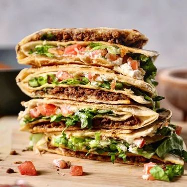 10 'Impossible' Meat Recipes for When You've Run Out of Ideas | Hunker Pesto Flatbread Recipes, Tiktok Tortilla Wrap, Impossible Meat, Vegan Patties, Tortilla Wrap, Impossible Burger, Food Inc, Tortilla Wraps, Vegan Kitchen