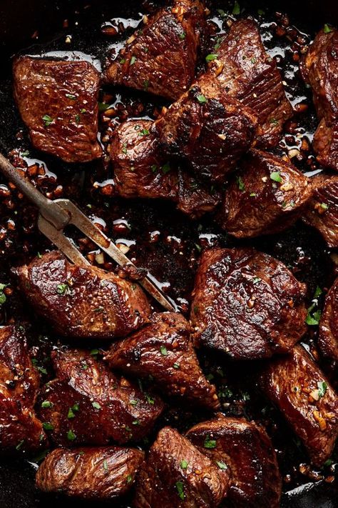 Buttery and tender, these cast iron seared steak bites are cooked to perfection and then drizzled with homemade garlic butter. Dip these juicy butter steak bites in our garlic aioli dipping sauce. Sticky Steak Bites, Pan Fried Steak Bites, Cast Iron Steak Bites, Top Round Steak Dinner Ideas, Pork Steak Bites, Chuck Roast Bites Recipes, Steak With Butter Sauce, Steak Tidbits Recipes, Cube Meat Recipes