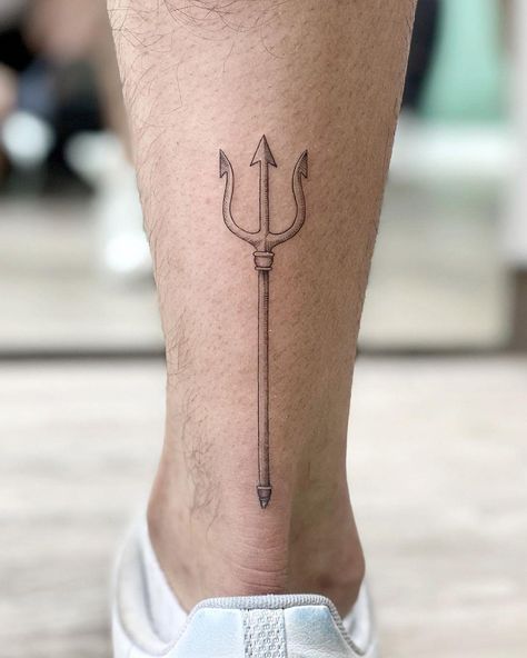 Small trident tattooed on the left calf by @soychapa Calf Tattoo Men Minimalist, Mens Trident Tattoo, Trident Leg Tattoo, Feminine Trident Tattoo, Minimalist Trident Tattoo, Mens Calf Tattoos Ideas Simple, Trident Forearm Tattoo, Greek Trident Tattoo, Poseidon Tattoo Minimalist