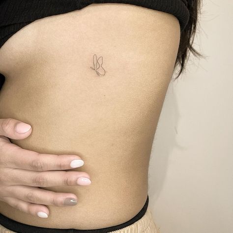 Continuous Line Tattoos, Minimalist Butterfly Tattoo, Tiny Butterfly Tattoo, Continuous Line Tattoo, Minimalist Butterfly, Rib Tattoos For Women, Hip Tattoos Women, Petite Tattoos, Rib Tattoo