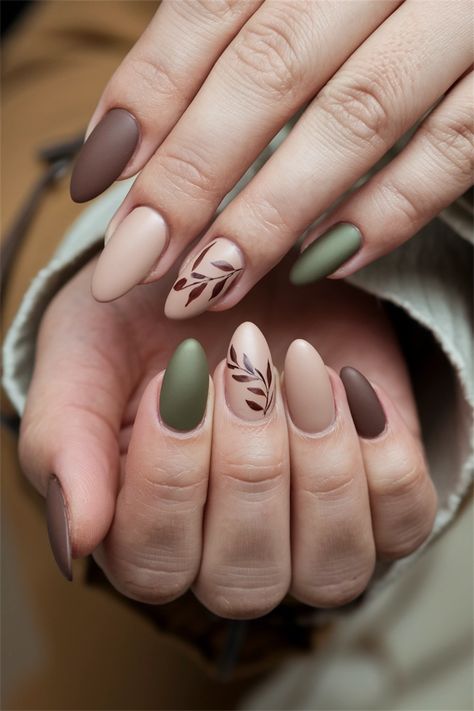 Embrace the cozy vibes of autumn with these simple yet chic fall nail ideas! Featuring warm earth tones and delicate leaf motifs, this nail design captures the essence of the season. The muted shades of burnt orange and deep burgundy complement any outfit, making it perfect for casual outings or festive gatherings. Get inspired to try this elegant look that combines simplicity with seasonal charm! Simple Earth Tone Nails, Olive Green Nails Almond Shape, Fall Nail Designs Sage Green, Fall Nails Monochromatic, Autumn Nails For Short Nails, Fun Fall Nails Designs, Nude Fall Nails Short, Olive Green And Cream Nails, Tone On Tone Nails