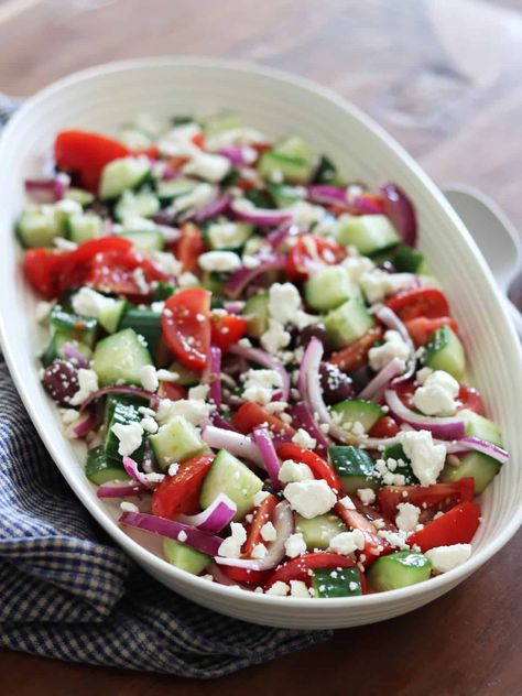 This mouth-watering traditional Greek salad featuring fresh cucumbers, feta cheese, tomatoes and olives comes together in just 20 minutes. Simple Greek Salad, Cucumber Tomato Feta Salad, Tomato Feta Salad, Classic Greek Salad, Greek Salad Ingredients, Traditional Greek Salad, Vegan Feta Cheese, Greek Salad Dressing, Feta Cheese Salad