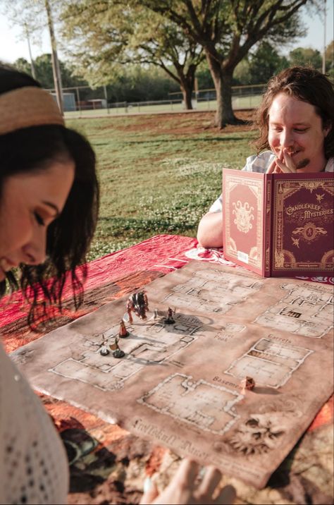 Dungeons and dragons engagement photos Dungeons And Dragons Senior Pictures, Dungeons And Dragons Photoshoot, Gamer Couple Photoshoot, Medieval Engagement Photos, Nerdy Couple Photoshoot, Nerd Engagement Photos, Dnd Engagement Photos, Board Game Engagement Photos, Nerdy Engagement Photos