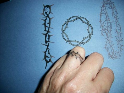 Crown of thornes finger tats Crown Of Thorns Tattoo, Thorns Tattoo, Simple Cross Tattoo, Thorn Tattoo, Thorn Ring, Finger Tats, Ring Finger Tattoos, Ring Tattoos, Finger Tattoo