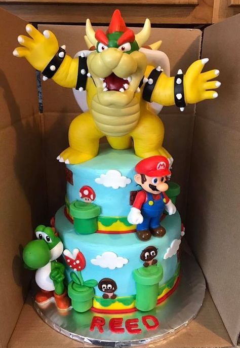 Super Mario Brothers Super Mario Brothers cake with toy characters and fondant accents. Super Mario And Bowser Cake, Super Mario Lego Cake, Mario And Bowser Birthday Cake, Bowser Birthday Party Cake, Super Mario Cake Bowser, Super Mario Movie Cake, Mario And Bowser Cake, Super Mario Theme Cake, Super Mario Cupcakes Birthday Ideas