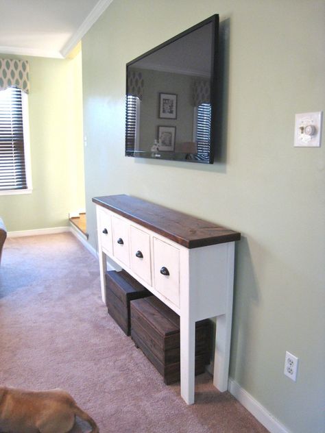 like the white with the wood top and I LOVE the crates for extra storage or seating! Tv With Table Underneath, Under The Tv Table, Table For Under Tv Mounted Tv, Table Under Tv Decor Mounted Tv, Console Table With Ottomans Under Tv, Wooden Crate Tv Stand, Under Tv Table, Table Under Tv Decor, Table Under Mounted Tv