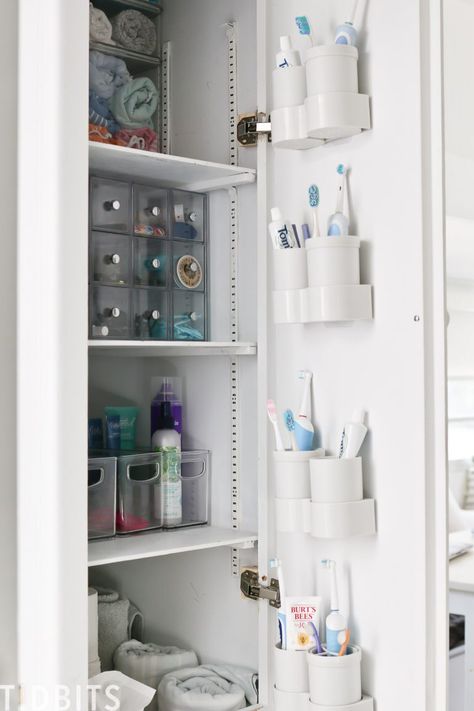 Toothbrush Storage Small Bathroom, Bathroom Cubby Organization, Large Family Bathroom Organization, Large Family Toothbrush Organization, Where To Put Toothbrush In Bathroom, Small Family Bathroom Storage, Bathroom Cubbies, Toothbrush Storage Ideas, Bathroom Cabinet Organization Ideas