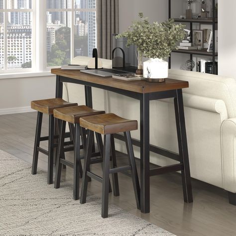 PRICES MAY VARY. Wood [Farmhouse Charming] Striking a simply chic pose, this dining set is styled with flair. Pub height table and chairs with a two-tone black and brown finish serve a wonderful addition to your kitchen, game room, or living room [Well Crafted] The pub table set is constructed with solid wood, sturdy and durable. The stool can hold up to 250 lbs. Contoured saddle seat and foot rests offer comfort and support [Perfect Fit] The pub height table measures: 72''W x 18''D x 42.5''H, S Console Table With Stools, Nook Living Room, Pub Height Table, Small Kitchen Table Sets, Small Kitchen Table, Saddle Bar Stools, Bar Table Set, Kitchen Table Set, Small Kitchen Tables