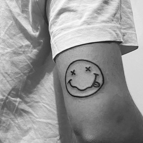 Nirvana Face Tattoo, Kurt Cobain Inspired Tattoo, Small Nirvana Tattoo, Nirvana Smiley Face Tattoo, Kurt Cobain Tattoo Ideas, Nirvana Logo Tattoo, Nirvana Tattoo Lyrics, Grudge Tattoos, Nirvana Tattoo Ideas