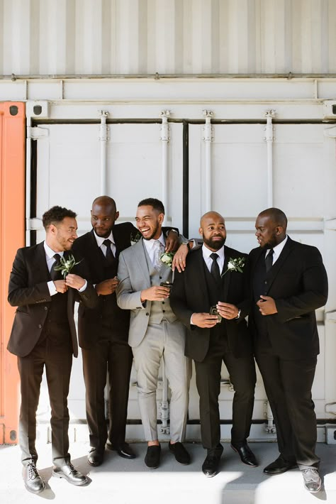 Grey Grooms Suit Wedding, Grey Suit Groom And Groomsmen, Gray Groom Black Groomsmen, Groom In Grey Groomsmen In Black, Grey Groom Suit With Bride, Black And Grey Groomsmen, Grey And Black Wedding Party, Black And Gray Groomsmen Attire, Groom Attire Grey Suit