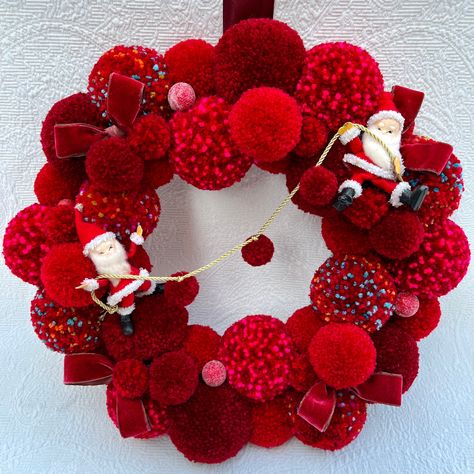 Two elfen Santa figures hanging on a mini pom garland nestled in a mass of red pompoms. Peppered with vintage velvet bows and berries. This wreath measures 16 inches. Sure to make anyone smile! Jingle Bell Crafts, Paper Wreath Diy, Vintage Ornament Wreath, Red Pom Poms, Crochet Christmas Ornaments Free, Mini Pom, Pom Pom Wreath, Velvet Bows, Christmas Crafts For Kids To Make