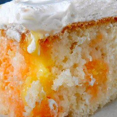 Ingredients: 1 box orange cake mix (Duncan Hines has a delicious boxed cake mix)  1 small box orange Jell-O Gelatin  1 c. hot water   FROSTING  1 small box instant vanilla pudding  1 c. milk  1 tsp. vanilla  ½ tsp. orange extract  1 tub Cool Whip, thawed, or whipped cream