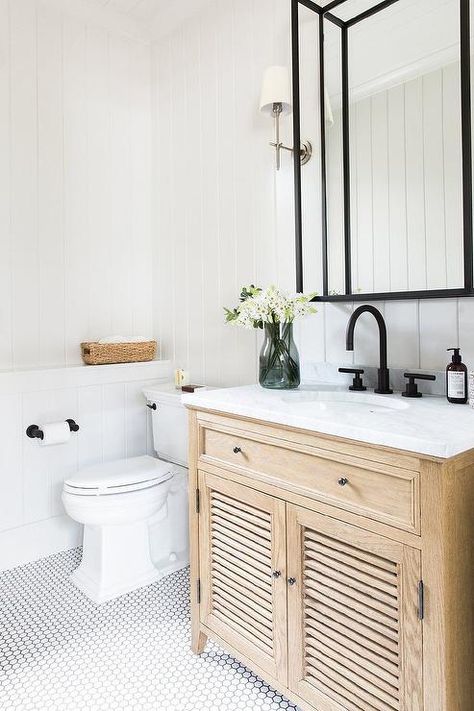 Charming cottage bathroom is clad in white hex floor tiles accented with a Restoration Hardware Shutter Single Vanity finished with louvered cabinets, a carrera marble countertop, a round sink, and oil rubbed bronze gooseneck faucet. Neutral Bathrooms Designs, Studio Mcgee Bathroom, Mcgee Bathroom, Spare Bathroom, Modern Farmhouse Bathroom, Classic Bathroom, Shutter Doors, Studio Mcgee, Natural Home Decor