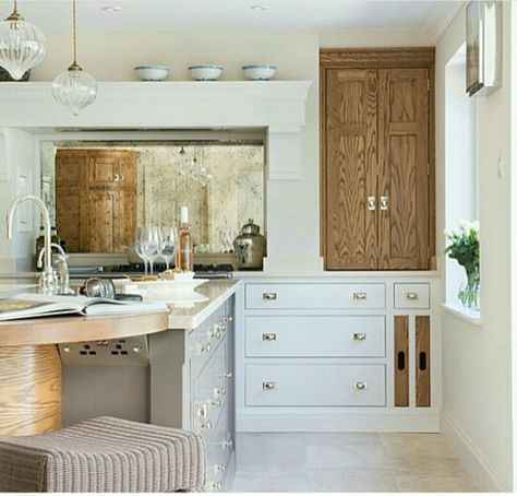 Antiqued mirror behind stove. Muted neutral colors. Mantle over cooker. Antique Mirror Behind Stove, Mirror Behind Stove, Antique Mirror Backsplash, Gray Subway Tile Backsplash, Mother Of Pearl Backsplash, Stone Backsplash Kitchen, Hexagon Backsplash, Farmhouse Backsplash, Mirror Backsplash