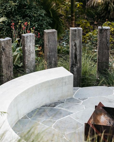 Relaxed fire pit zone featuring off form concrete bench, bluestone crazy paving, recycled sleeper screen and soft native planting 🌿 | Instagram Crazy Paving Fireplace, Crazy Pave Fire Pit, Bluestone Crazy Paving, Crazy Paving Fire Pit, Paved Fire Pit Area, Off Form Concrete, Crazy Pave, Bluestone Paving, Denmark House