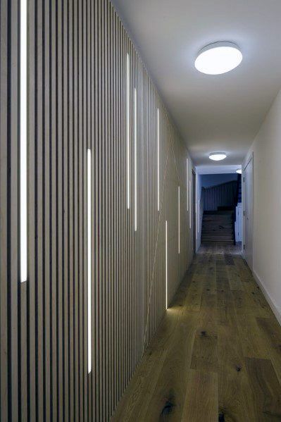 Another example of wood paneling with LED strip lights. In a hallway, that's pretty interesting I think. Blitz Design, Interior Light Fixtures, Deco Led, Corridor Design, Wall Lamps Living Room, Corridor Lighting, Led Light Design, Long Hallway, Hallway Lighting