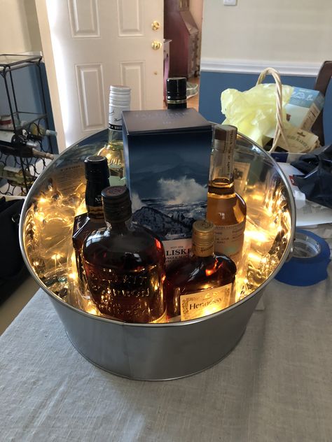 My silent auction alcohol bucket Alcohol Fundraiser Ideas, Christmas Gift Baskets With Alcohol, Whiskey Auction Basket Ideas, Bourbon Gift Basket Ideas, Alcohol Basket Ideas, Booze Basket Fundraiser, Cooler Silent Auction Basket, Best Silent Auction Items, Bourbon Gifts Basket