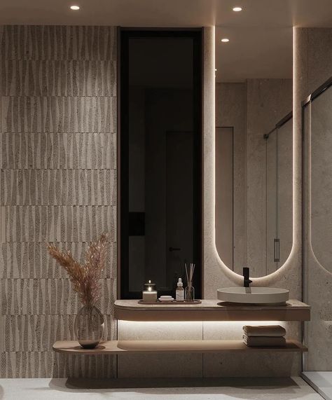 Discover a beautiful bathroom with stylish LED lighting, rounded shapes, textured walls, and chic black accents on beige interiors. Every detail radiates pure luxury 👌🏼 Follow @lyxvillan for more inspiration Credit: @tawazon_architects #luxuryliving #luxurybathroom #luxurybathrooms #modernbathroom #lightingdesign #lightingideas #lightinginspiration #bathroomlighting Luxurious bathroom, LED lighting, rounded shapes, textured walls, black accents, beige interiors, stylish design, elegant b... Bathroom Modern Lighting, Contemporary Washroom Design, Door Design Interior Unique, Wc Modern Design, Tawazon Architects, Dark Moody Bathroom Ideas, Luxury Bathroom Black, Beige Tiles Bathroom, Long Bathrooms Ideas