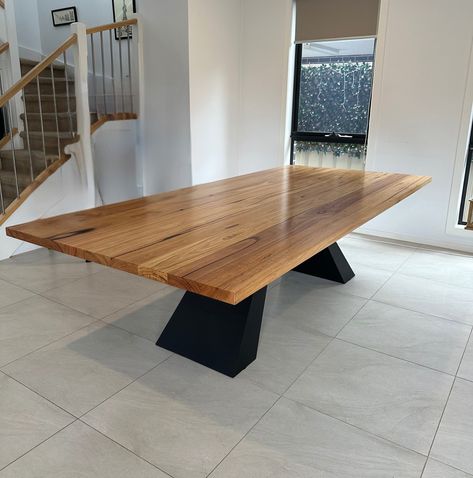 This stunning Monaco dining table features a beautifully crafted solid timber top with striking natural grain patterns. The table is elevated by premium-quality legs made from 10mm solid steel plate, giving it both an industrial edge and unmatched durability. The sleek, black powder-coated finish of the legs perfectly complements the warmth of the timber, creating a bold yet timeless piece that stands as a centerpiece in any modern space. https://lumberfurniture.com.au/products/monaco-di... Recycled Timber Furniture, Timber Vanity, Timber Shelves, Live Edge Dining Table, Timber Furniture, American Black Walnut, Metal Dining Table, Contemporary Furniture Design, Square Dining Tables